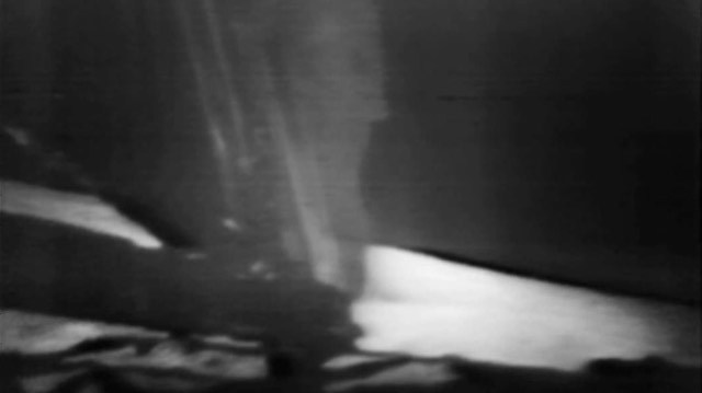 Black-and-white video frame from NASA’s Apollo 11 moonwalk broadcast
